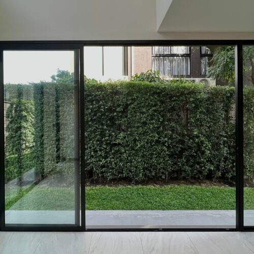 Double,Sliding,Door,With,Green,Garden,Of,Backyard,View.,Outdoor